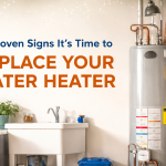 A professionally installed residential water heater in a clean Florida utility room, featuring copper piping and shutoff valves, illustrating signs that it may be time to replace a water heater in Venice, FL.